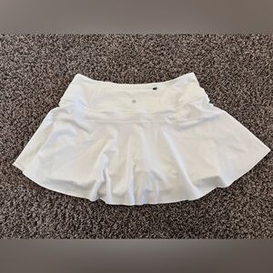 Never worn - athleta tennis skort skirt with shorts under and pockets